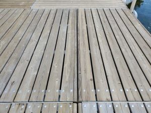 This photo shows panel on right that I stripped and cleaned (Behr), one on left was only cleaned. (Far panel was also stripped. Upper left corner nothing so far. Yes, my pier looks rather checkerboard right now. )